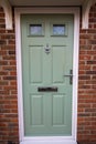 Green door. Modern house composite UPVC front door Royalty Free Stock Photo