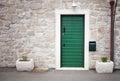 Green door in old stone house Royalty Free Stock Photo