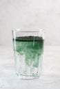 Green drink prepared with single celled green algae chlorella. Detox superfood in the glass