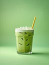 Green drink with a yellow straw on a green background