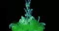 Green Ink Colors in Water Creating Liquid Art Shapes Royalty Free Stock Photo