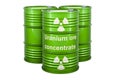 Green drums with uranium ore concentrates, 3D rendering isolated