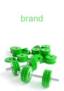 Green dumbbells on a white background close-up