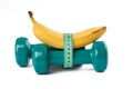 Green dumbell and banana Royalty Free Stock Photo