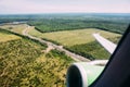 Green earth and plane wing view from an illuminator Royalty Free Stock Photo