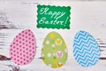 Green Easter card and paper eggs.