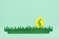 Green easter egg with yellow bunny and fabric green handmade grass on a light green background. Easter greeting card with green Royalty Free Stock Photo