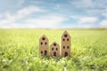 Green eco cardboard model house in empty field Royalty Free Stock Photo