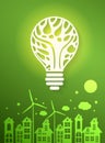 Green eco city with dry tree in light bulb eco concept Royalty Free Stock Photo