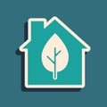 Green Eco friendly house icon isolated on green background. Eco house with leaf. Long shadow style. Vector Royalty Free Stock Photo