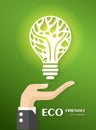 Green ecology bulb on hand