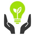 Green ecology bulb in open hands