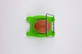Green egg cutter with a boiled egg Royalty Free Stock Photo