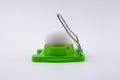 Green egg cutter with a boiled egg Royalty Free Stock Photo