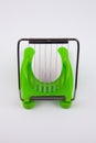 Green egg cutter with a boiled egg Royalty Free Stock Photo