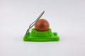 Green egg cutter with a boiled egg Royalty Free Stock Photo
