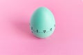 Green egg timer on pink background. Happy Easter in the kitchen. Home related, home staying. Free copy space. Flat lay, top view Royalty Free Stock Photo