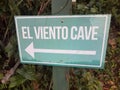 Green El Viento, the wind, cave sign with arrow in the Guajataca forest in Puerto Rico with lizard