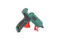 Green electric glue gun, useful accessory for homes isolated