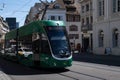 Green electric tram of the tram network of the public transport company Basel, Switzerland