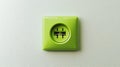 Green Electrical Outlet with Two Plugs Inserted Royalty Free Stock Photo