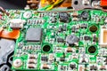 Green electronic board with many capacitors and resistors close-up. Electronic camera chip