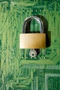 Green electronic board with a padlock as a computer security concept Royalty Free Stock Photo