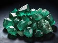 Green Emerald gemstone with rough cut or uncut. Dark studio background Royalty Free Stock Photo