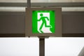Green emergency exit sign. Royalty Free Stock Photo