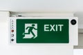 Emergency exit sign. Direction to the escape way. Royalty Free Stock Photo