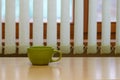 Green empty cup on the table Royalty Free Stock Photo