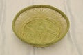 Green empty handmade bamboo basket isolated. Bread storage container Royalty Free Stock Photo