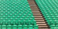 Green empty stadium folding seats and wooden stairs Royalty Free Stock Photo