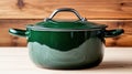 Green enamel cast iron pot on wooden background Royalty Free Stock Photo