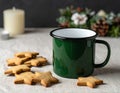 Green Enamel Mug With Star Shaped Cookies And Candle On Table Royalty Free Stock Photo