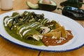 Green enchiladas mexican food with tomato sauce and cheese in mexico Royalty Free Stock Photo