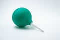 Green enema on a white background. Constipation treatment.