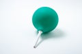 Green enema on a white background. Constipation treatment.