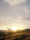 Green energy background Beautiful sunset landscape with windmill