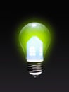 Green energy concept. Lamp bulb with a paper house. Royalty Free Stock Photo