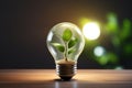 Green energy concept. Light bulb with soil and green plant sprout inside. Ecology and environment sustainable resources Royalty Free Stock Photo