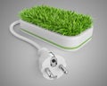 Green energy concept with plug and pot with grass. Royalty Free Stock Photo