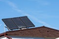 Green energy, solar collectors on the roof of a family house Royalty Free Stock Photo