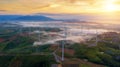 Green Energy Wind Turbine, Aerial view sunrise from Drone flying