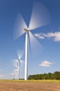 Green Energy Wind Turbines In Field of Sunflowers Royalty Free Stock Photo