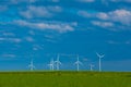 Green energy.Windmills set in a green field against a blue sky.Wind generator in green grass.renewable energy Royalty Free Stock Photo