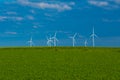 Green energy.Windmills set in a green field against a blue sky.Wind generator in green grass.renewable energy Royalty Free Stock Photo