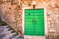 Green entrance doors of Church of St. Peter and Paul in Risan,