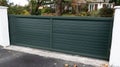 Green entry closed house door metal home gate entrance Royalty Free Stock Photo