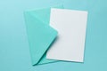 Green envelope and blank letter on green background. Template with place for text on postcard. mock-up Royalty Free Stock Photo